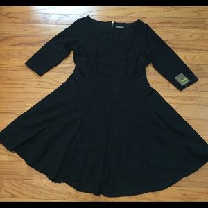 Black 3/4 sleeve fit and flare dress.